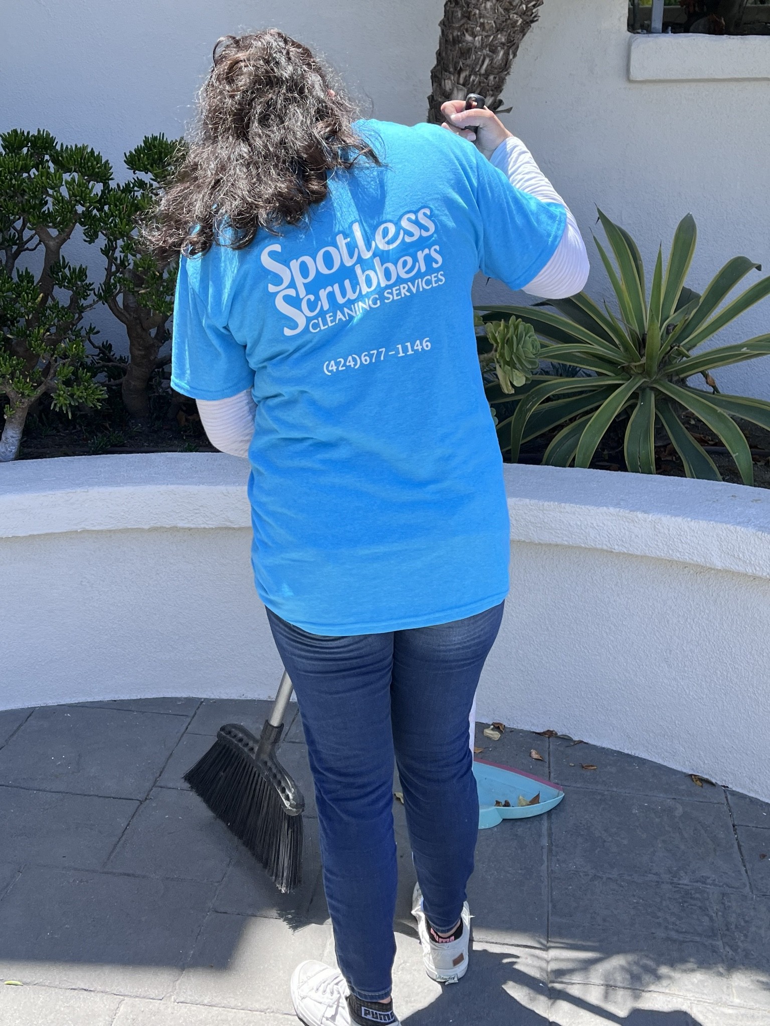 Spotless Scrubbers crew cleaning residential property